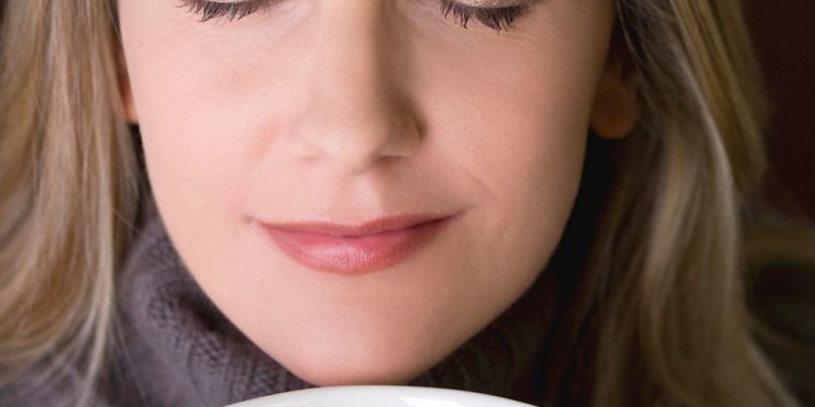 Woman smelling soup, eyes