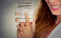 Brunette Holding a Food Label