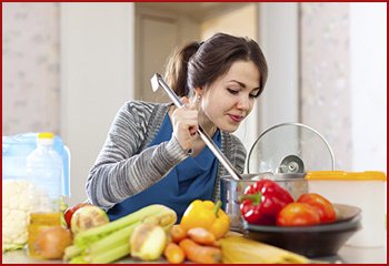 woman cooking and tasting food